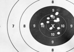Black and white, Close up of a shooting target and bullseye with Black and white, Close up of a shooting target and bullseye with bullet holes